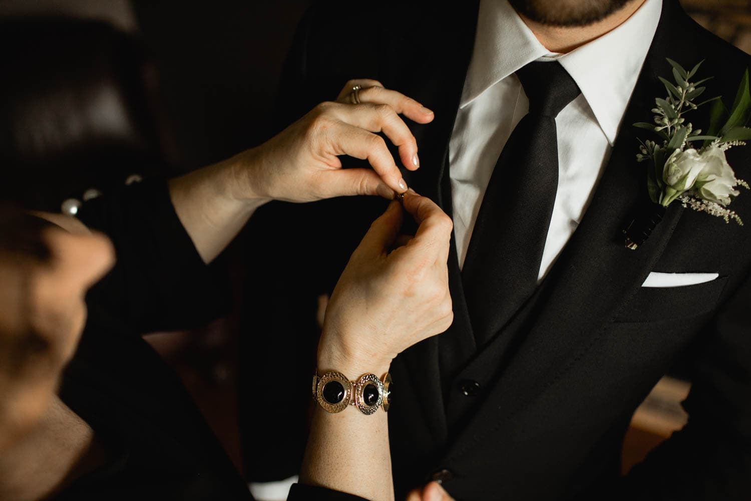 groom with an antique pin