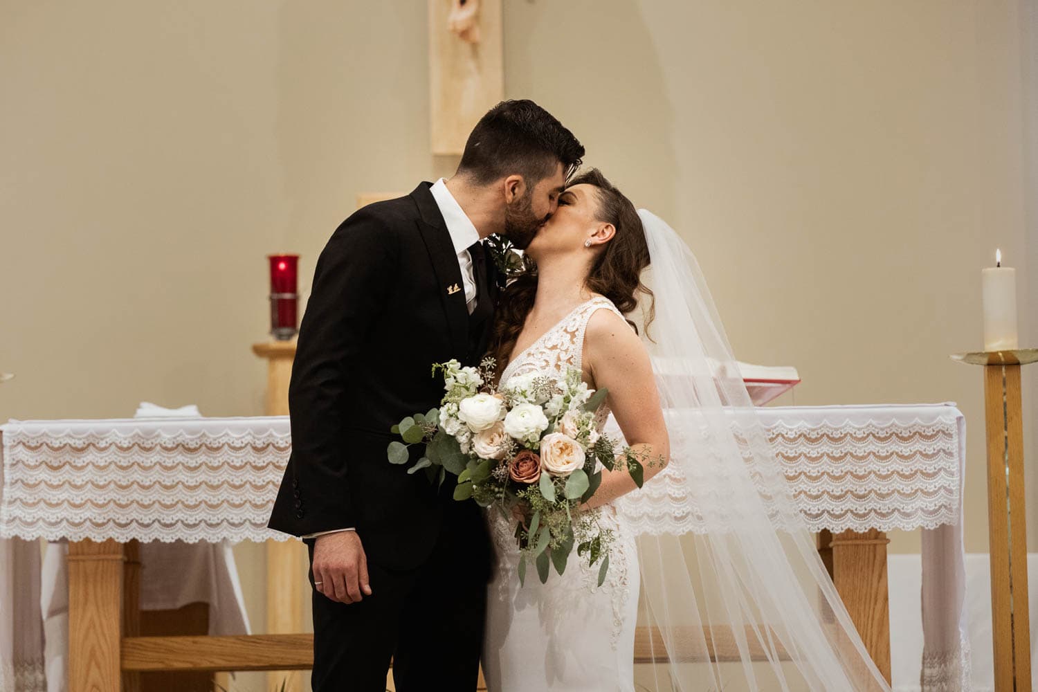 bride and groom first kiss
