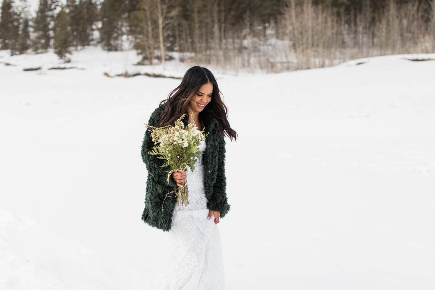 Bride walking down to Abraham Lake