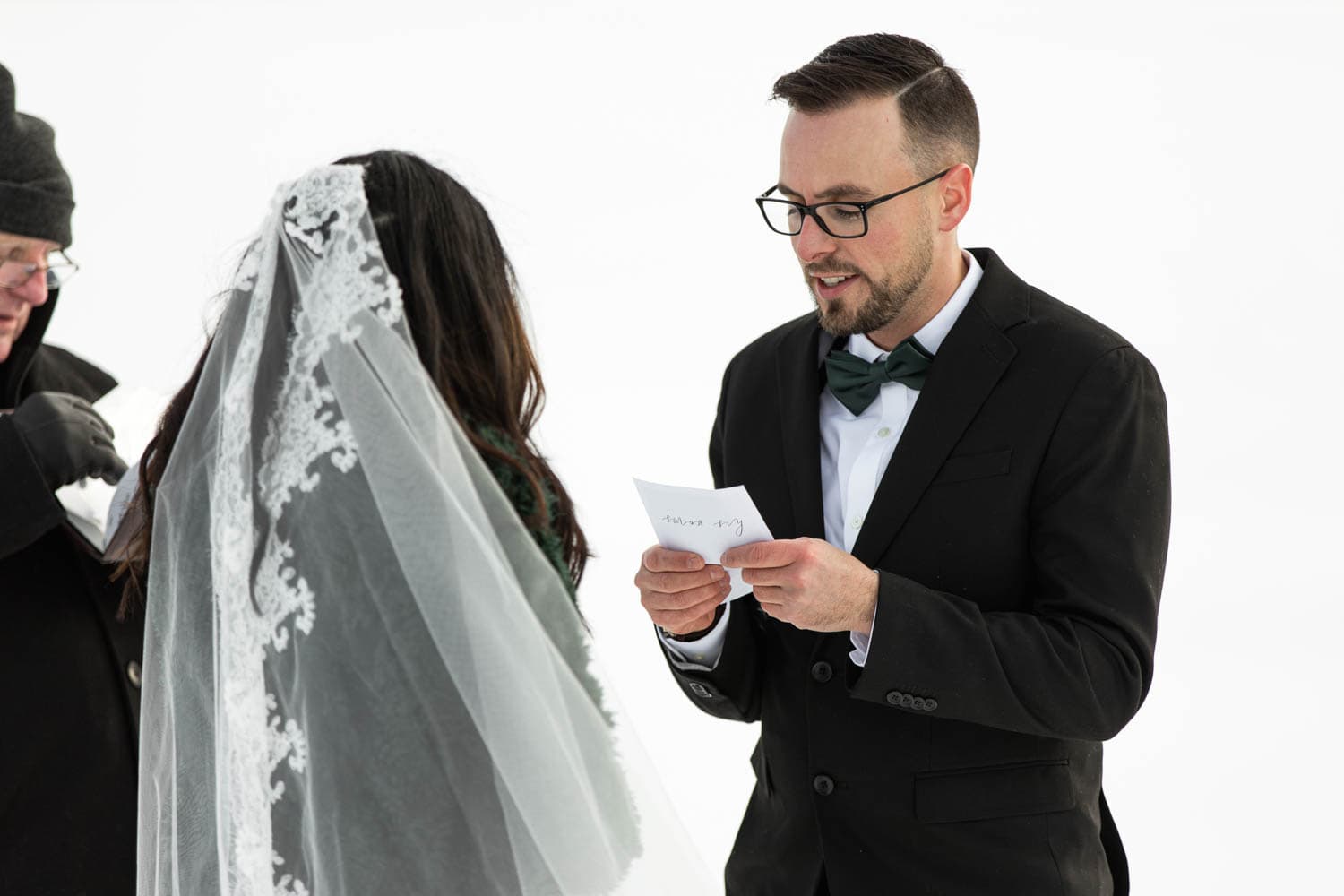 groom at winter ceremony